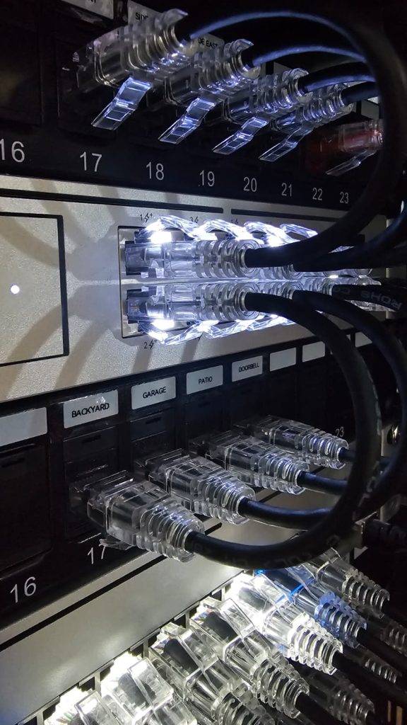 Organized bundle of black network cabling and power wires secured with zip ties.
