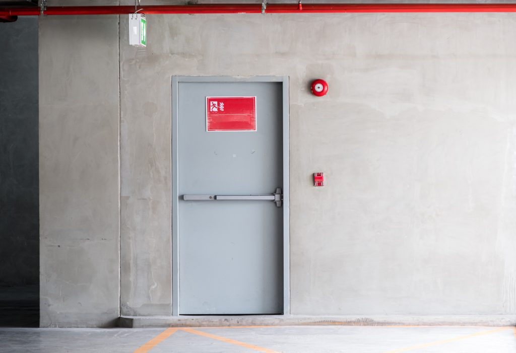 Fire exit door for emergency case of the parking building near the business office.